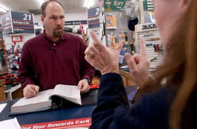 Grant Merwin, owner of Merwin's True Value in Sandpoint, helps a customer Thursday.
(Kathy Plonka / The Spokesman-Review)