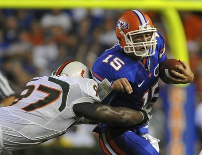 Florida quarterback Tim Tebow scrambles against Miami.  (Associated Press / The Spokesman-Review)