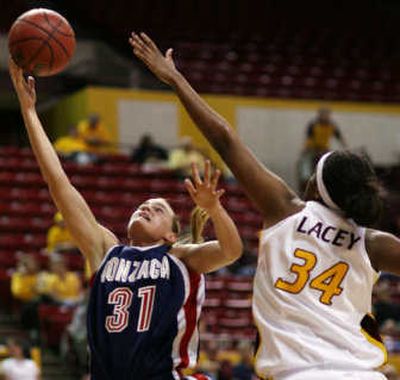 
Gonzaga's Michelle Elliott lays in two points over Arizona State center Lauren Lacey on Friday. Associated Press
 (Associated Press / The Spokesman-Review)