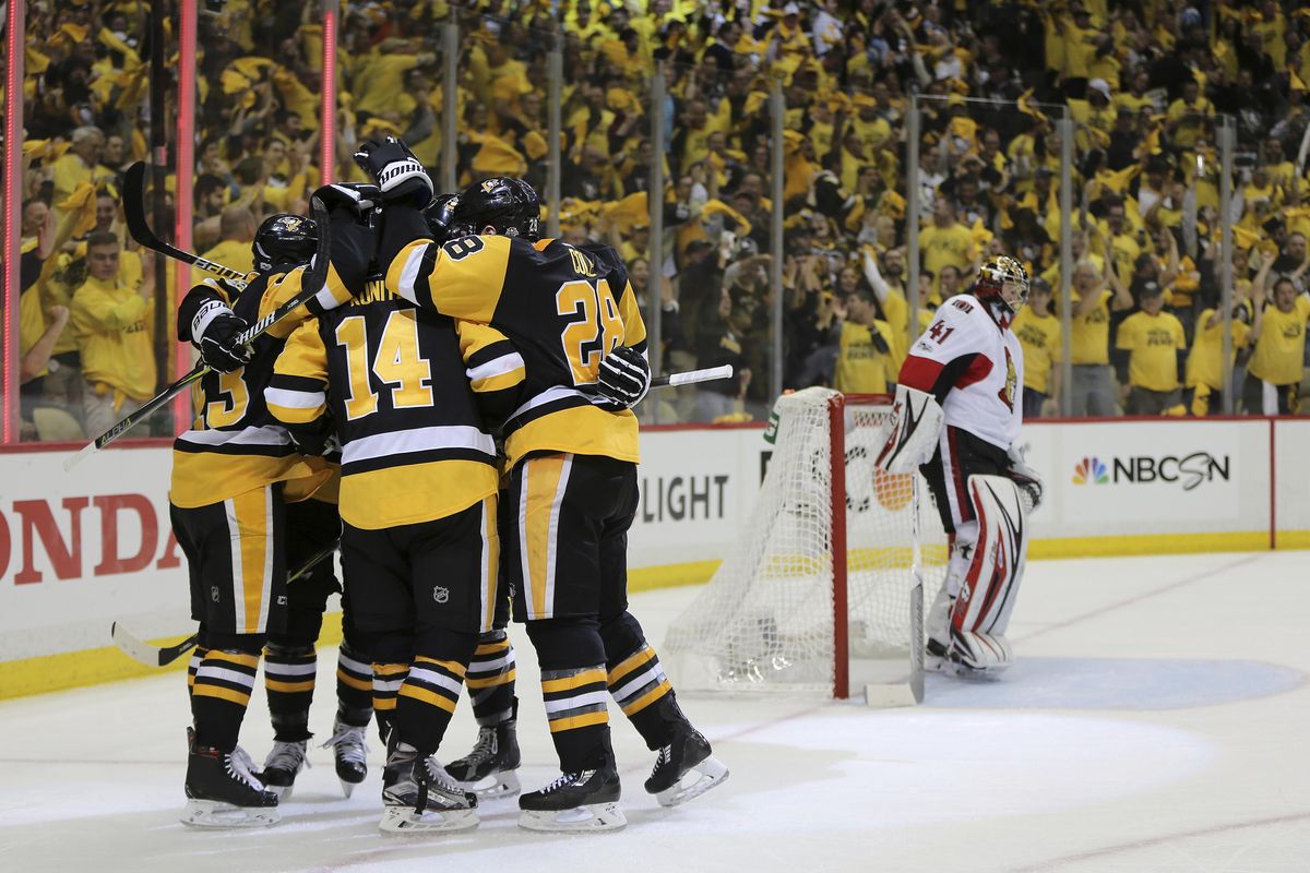 Pittsburgh Penguins left wing Chris Kunitz (14) celebrates with teammates after scoring a goal against the Ottawa Senators during the first period of Game 7 in the NHL hockey Stanley Cup Eastern Conference finals, Thursday, May 25, 2017, in Pittsburgh. (Keith Srakocic / Associated Press)