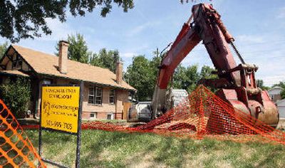 
Construction equipment is being used to clear the bungalows in neighborhood in south Denver. The National Trust for Historic Preservation said teardowns threaten the character of 300 communities in 33 states.
 (Associated Press / The Spokesman-Review)