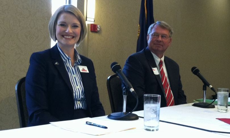 Holli Woodings, left, and Lawerence Denney, right, at the City Club of Boise debate on Monday (Betsy Russell)