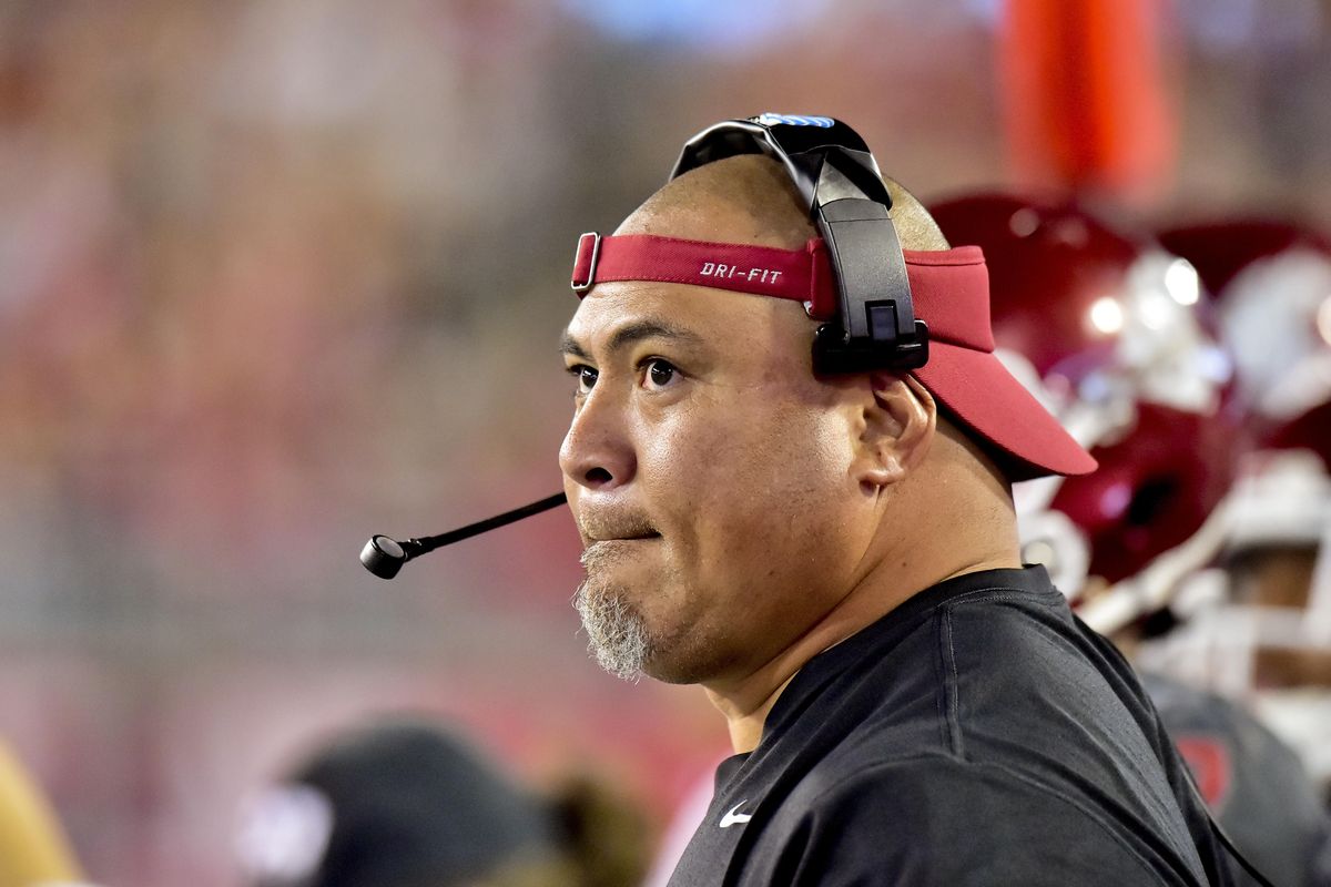 Washington State defensive line coach Joe Salave’a watches from the sidelines against Wyoming Sept. 19, 2015, in Pullman. Salave’a now coaches at Oregon. (Tyler Tjomsland / The Spokesman-Review)