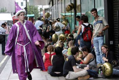 
Harry Potter fans, many of them dressed as characters from the story, wait outside a London bookstore for the release of an earlier book in the series in 2005. Associated Press
 (File Associated Press / The Spokesman-Review)