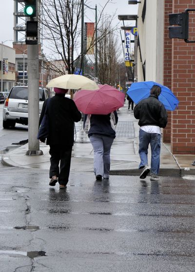 Umbrellas were out in abundance this morning as March rains continue. (Mike Prager)