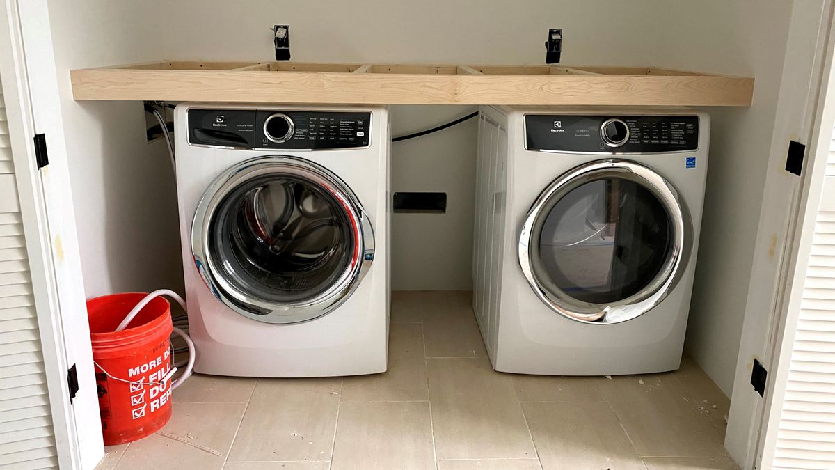 The washer and dryer will have a spacious counter over them. 