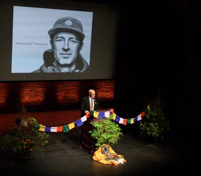 John Roskelley, father of Spokane alpinist Jess Roskelley, speaks about the life of his son during packed memorial at the Bing Crosby Theater on Friday. (Colin Mulvany / The Spokesman-Review)