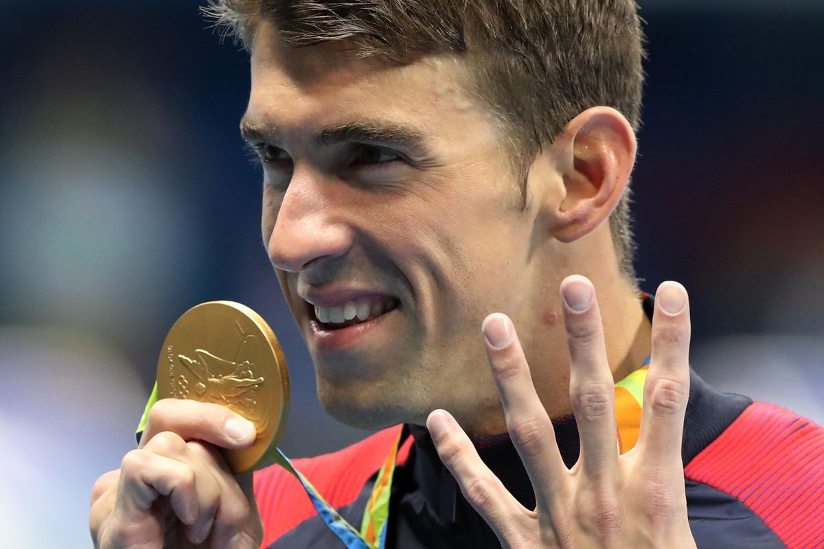 United States’ Michael Phelps celebrates winning the gold medal in the 200-meter individual medley for the fourth straight Olympics. (Lee Jin-man / Associated Press)