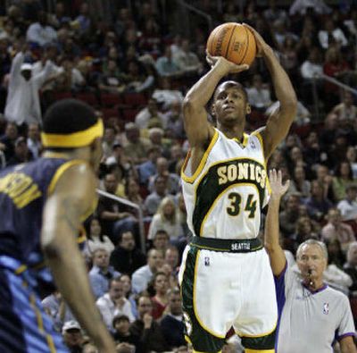 
Sonics guard Ray Allen shoots and makes his record-setting 268th 3-pointer of the season. He finished with 269.
 (Associated Press / The Spokesman-Review)
