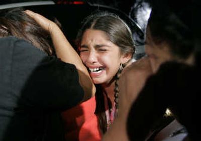 
Adilene Lerma, 10, cries as she and family members arrive to check on the condition of Adilene's father, Natalio, a rescue team member. Natalio Lerma was unhurt.Associated Press
 (Associated Press / The Spokesman-Review)