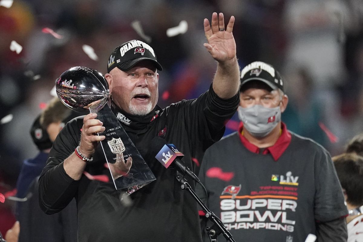 Tampa Bay Buccaneers head coach Bruce Arians holds up the Vince Lombardi trophy after defeating the Kansas City Chiefs in the NFL Super Bowl 55 football game Sunday, Feb. 7, 2021, in Tampa, Fla. The Buccaneers defeated the Chiefs 31-9 to win the Super Bowl.  (Ashley Landis)