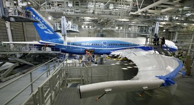 A Boeing 787 sits in the paint hangar at the company’s facility in Everett.  (File Associated Press / The Spokesman-Review)