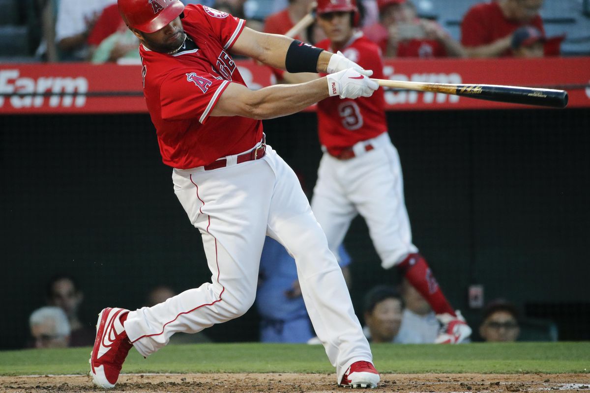 Los Angeles Angels' Albert Pujols hits a two-run home run during the first inning of the team's baseball game against the Seattle Mariners, Thursday, July 12, 2018, in Anaheim, Calif. (Jae C. Hong / AP)