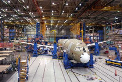 
A Boeing 787 airplane is shown on the assembly line in Everett. Boeing Co. delayed its 787 jetliner program again Wednesday, pushing back its expected debut in commercial service to the third quarter of 2009. Associated Press
 (File Associated Press / The Spokesman-Review)