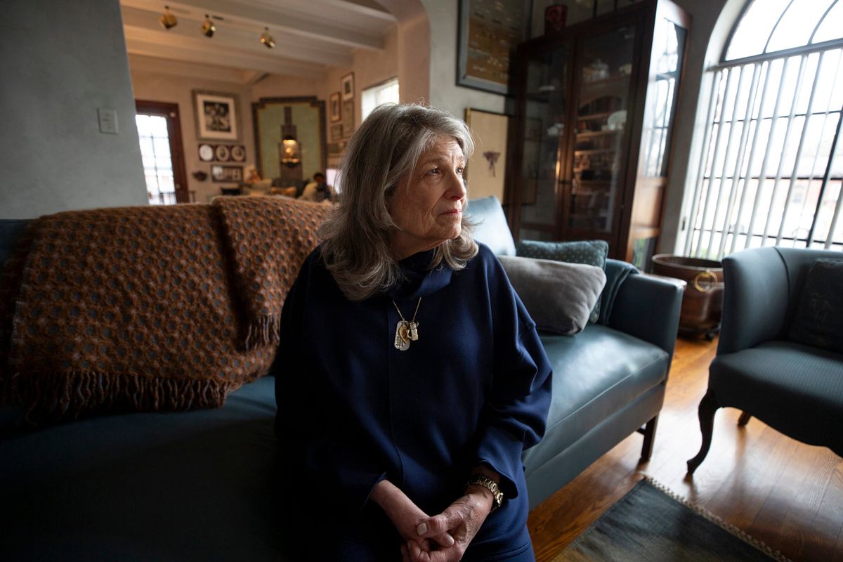 Carol Boigon at home in Denver on Jan. 13, 2026. To combat vaccine misinformation, Boigon joined an outreach coalition and is publicly sharing her story about being hospitalized with polio when she was 5. She never recovered full function in her right arm.  (Kevin J. Beaty/Colorado Public Radio)