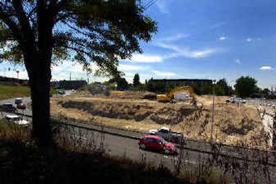 
Crews work on the new fire station at the south end of the Maple Street Bridge.
 (Christopher Anderson/ / The Spokesman-Review)