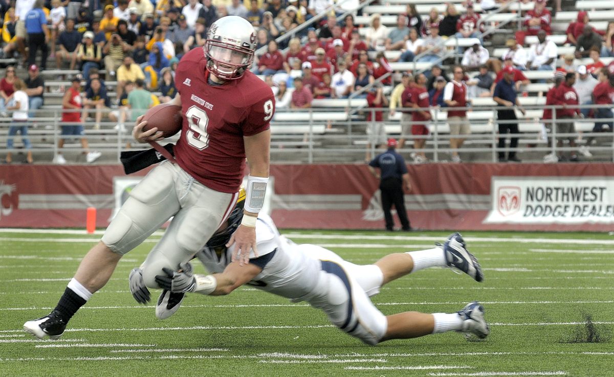 WSU quarterback Kevin Lopina had nowhere to run after replacing an ineffective Gary Rogers at halftime of a 66-3 loss to California. (Christopher Anderson / The Spokesman-Review)