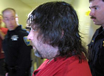 
Wayne Hower is led into the Kitsap County courtroom last June in Port Orchard, Wash.
 (Associated Press / The Spokesman-Review)