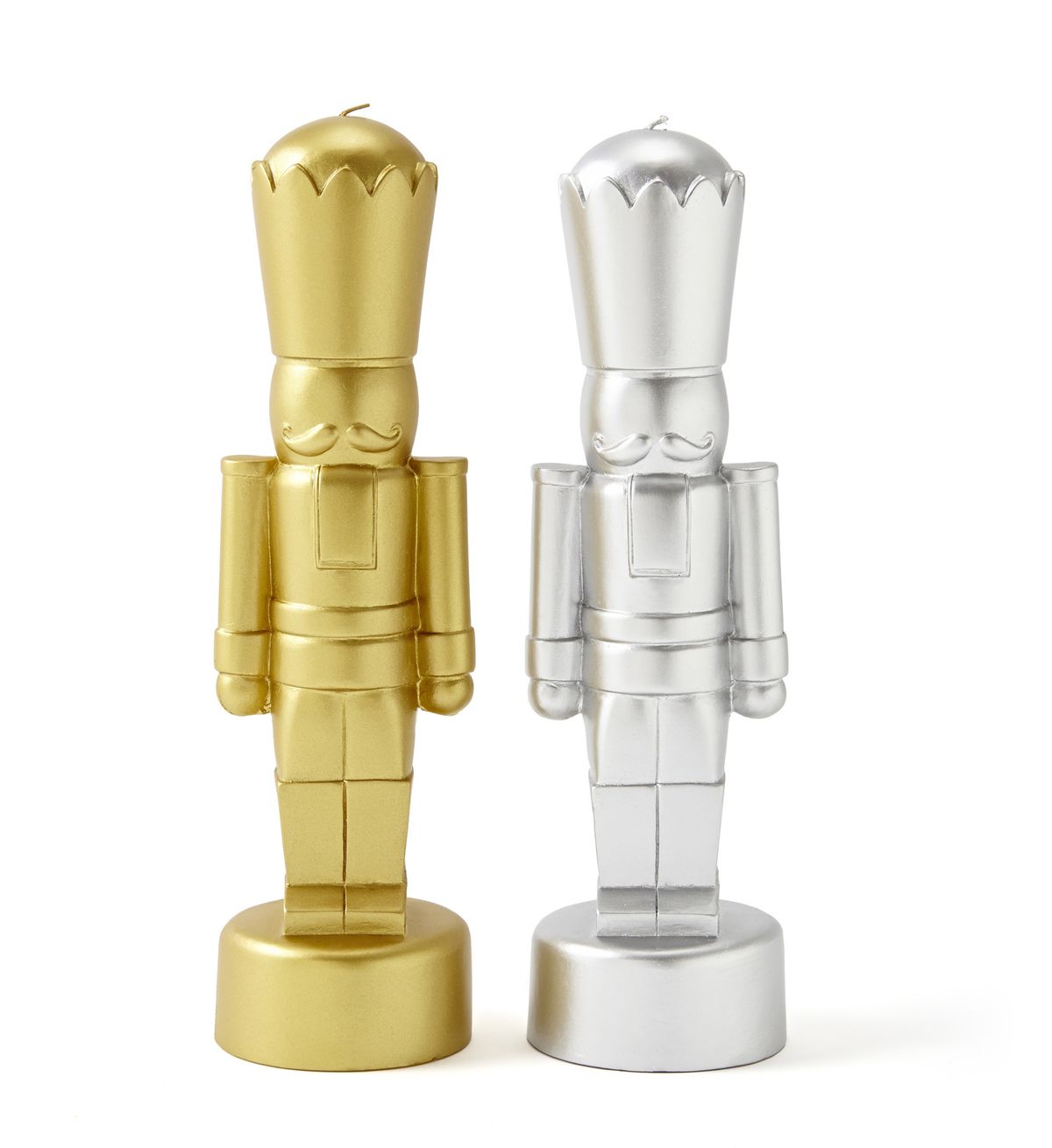Stylized nutcrackers in gold and silver are actually candles.