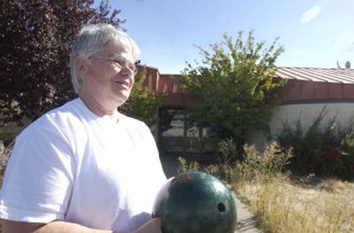 
In 1974, Mary Sperber became the first woman to bowl a 700 three-game series in Coeur d'Alene. She has bowled for 40 years, many at the weed-overgrown Sunset Bowling Center behind her. 
 (Jesse Tinsley / The Spokesman-Review)