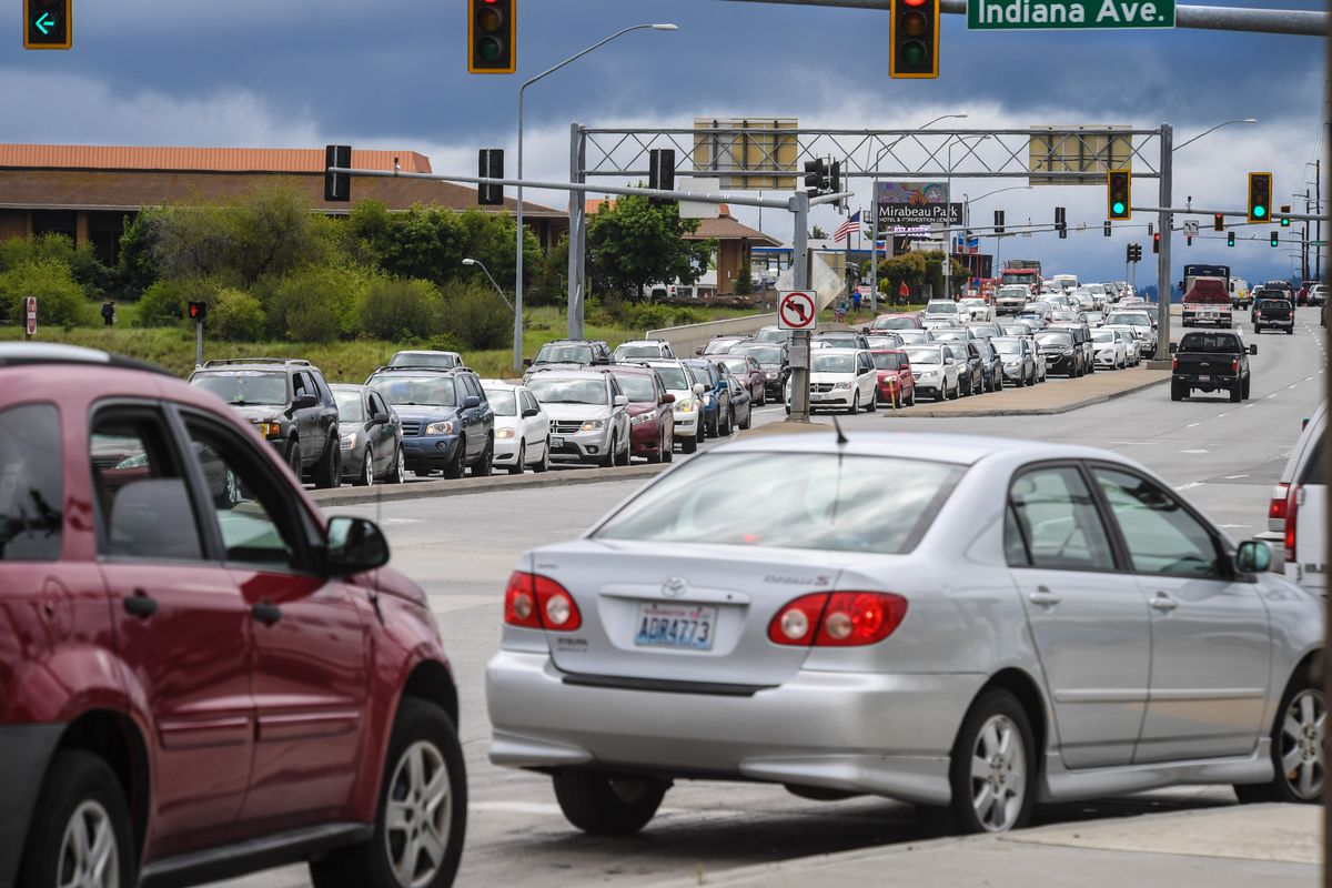 Traffic is backed up north-bound on Sullivan Road trying to turn west onto Indiana Avenue. More traffic and a housing crunch help underscore the population growth in Spokane and Kootenai counties detailed by new U.S. Census data released Thursday.  (DAN PELLE)