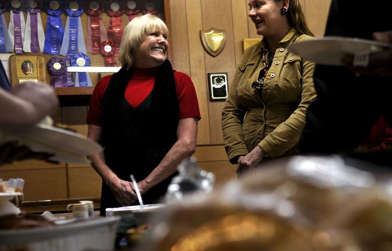 “This is going to be my new life,” said Karen King, left, of Coeur d’Alene, as she talked with Angela Thompson, of Post Falls, about the Cloverleaf Grange in Post Falls on Dec. 17. Attendance at the grange – established in 1906 – is currently on an upswing.  (Kathy Plonka)