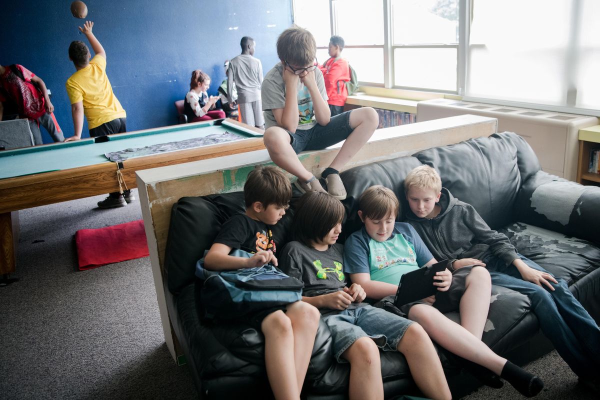 From left, Gabriel Richardson, Michael Richardson, Evan Walker, check out educational tablet held by Riley Sainsbury with Quinten Clark at the Boys & Girls Club in Spokane. The Club provides educational tablets like this one to stimulate learning during after school programs. The Boys and Girls Club was recently awarded a grant from the Inland Northwest Community Foundation - which is rebranding to "Innovia Foundation" - to fund The Club