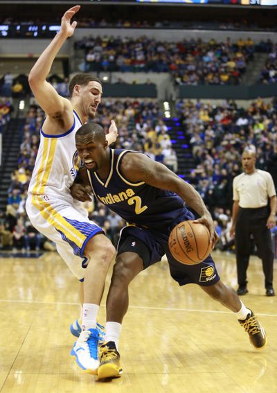Indiana Pacers guard Rodney Stuckey, right, runs into Golden State Warriors guard Klay Thompson while driving to the basket. (Associated Press)