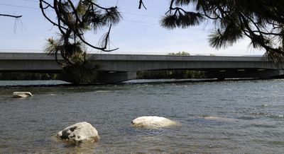 The Spokane River flows near the Harvard Road Bridge on Tuesday. Fast currents and low bridge clearances are creating  hazardous conditions. jesset@spokesman.com (JESSE TINSLEY jesset@spokesman.com / The Spokesman-Review)