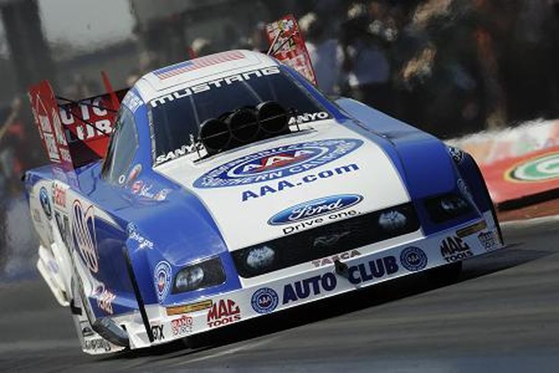 Robert Hight hammers down in his Ford Mustang en route to a win in Dallas. (Photo courtesy of NHRA) (The Spokesman-Review)
