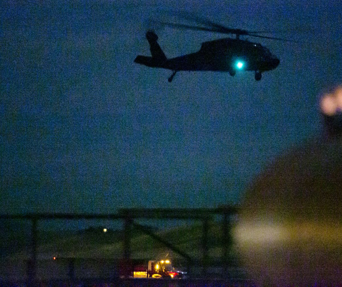 An Idaho National Guard helicopter lifts off from a crash site where another Guard helicopter was reported to have crashed south of Gowen Field in Boise Thursday Nov. 6, 2014 sometime after 7 p.m. There was no immediate word on injuries. (Darin Oswald / Idaho Statesman)
