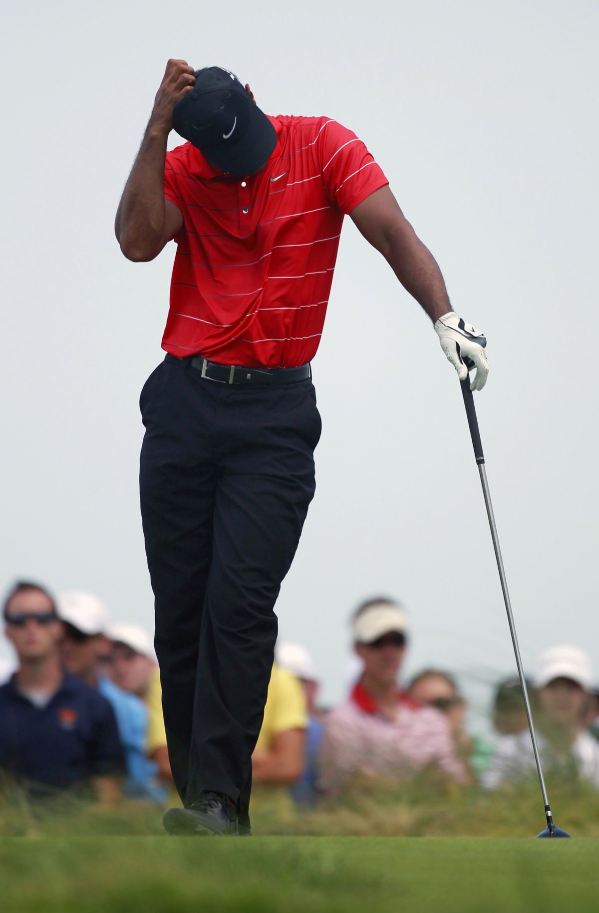 An errant tee shot on No. 9 left Tiger Woods scratching his head. (Associated Press)