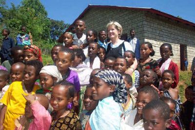 
Colleen Roe, a volunteer with Spokane's International Assistance Program, meets the children of micro-loan recipients in Dilla, Ethiopia. The church-based, nonprofit program provides aid to small businesses in under-resourced nations. 
 (Photo by Sandi Gress / The Spokesman-Review)