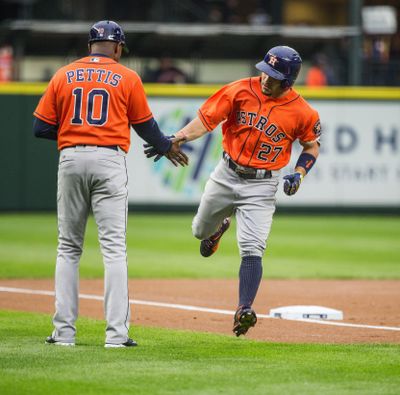 Astros second baseman Jose Altuve heads home after hitting a solo home run off Mariners pitcher Hisashi Iwakuma on Wednesday. (Dean Rutz / Tribune News Services)