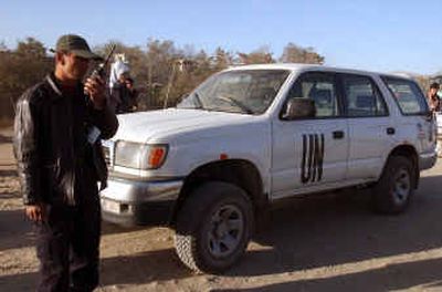 
A security officer talks on radio in front of a U.N. vehicle in which three kidnapped foreign staff members were riding Thursday in Kabul, capital of Afghanistan.A security officer talks on radio in front of a U.N. vehicle in which three kidnapped foreign staff members were riding Thursday in Kabul, capital of Afghanistan.
 (Associated Press Associated Press / The Spokesman-Review)