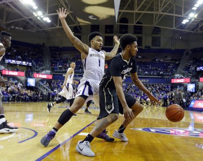 It may seem like there are a lot of empty seats at Huskies games but the school has announced an increase in attendance this season despite a losing record. (Ted S. Warren / Associated Press)
