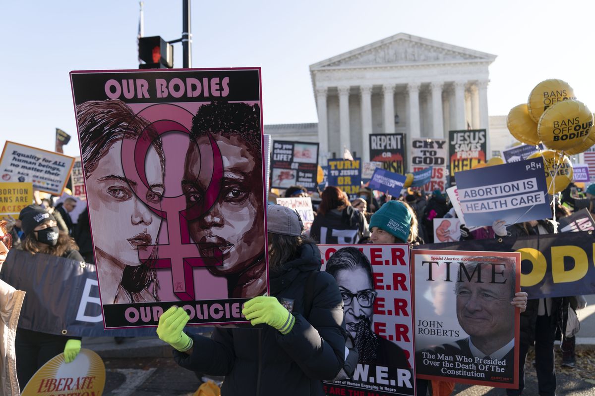 Abortion rights advocates demonstrate in front of the U.S. Supreme Court Wednesday, Dec. 1, 2021, in Washington, as the court hears arguments in a case from Mississippi, where a 2018 law would ban abortions after 15 weeks of pregnancy, well before viability.  (Jose Luis Magana)