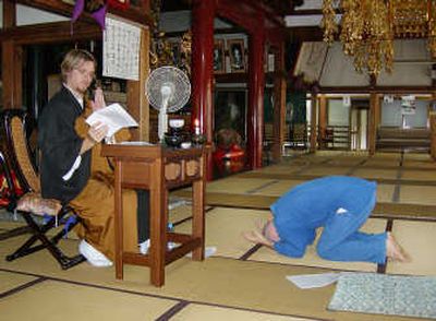 
Brad Warner, left, conducts a Zen ceremony for practitioner Ren Kuroda at Tokei-in, a Buddhist temple in Shizuoka, west of Tokyo Sept. 24. Warner, based in Los Angeles, wears the typical priestly robes but isn't your typical Zen master.Associated Press
 (Associated Press / The Spokesman-Review)