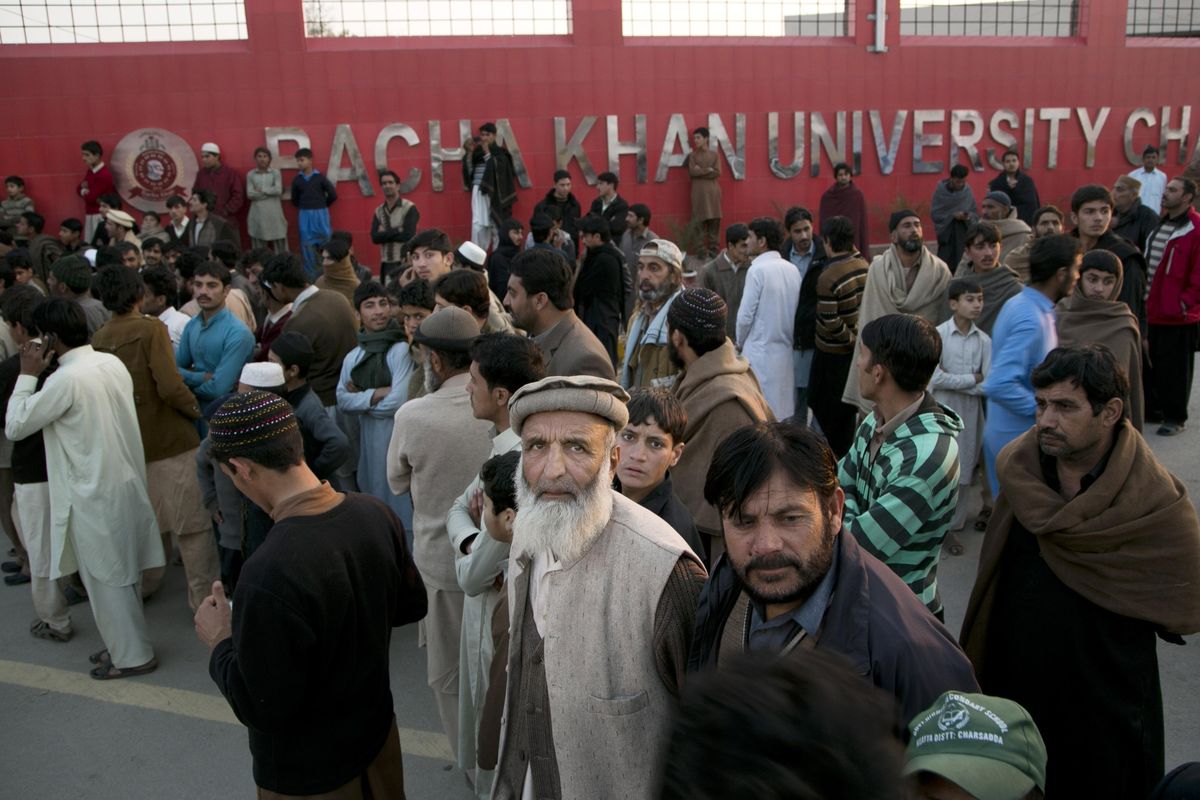 Family members of students stand outside the Bacha Khan University in Charsadda town, outside the city of Peshawar, Pakistan, Wednesday, Jan. 20, 2016. (B.k. Bangash / Associated Press)