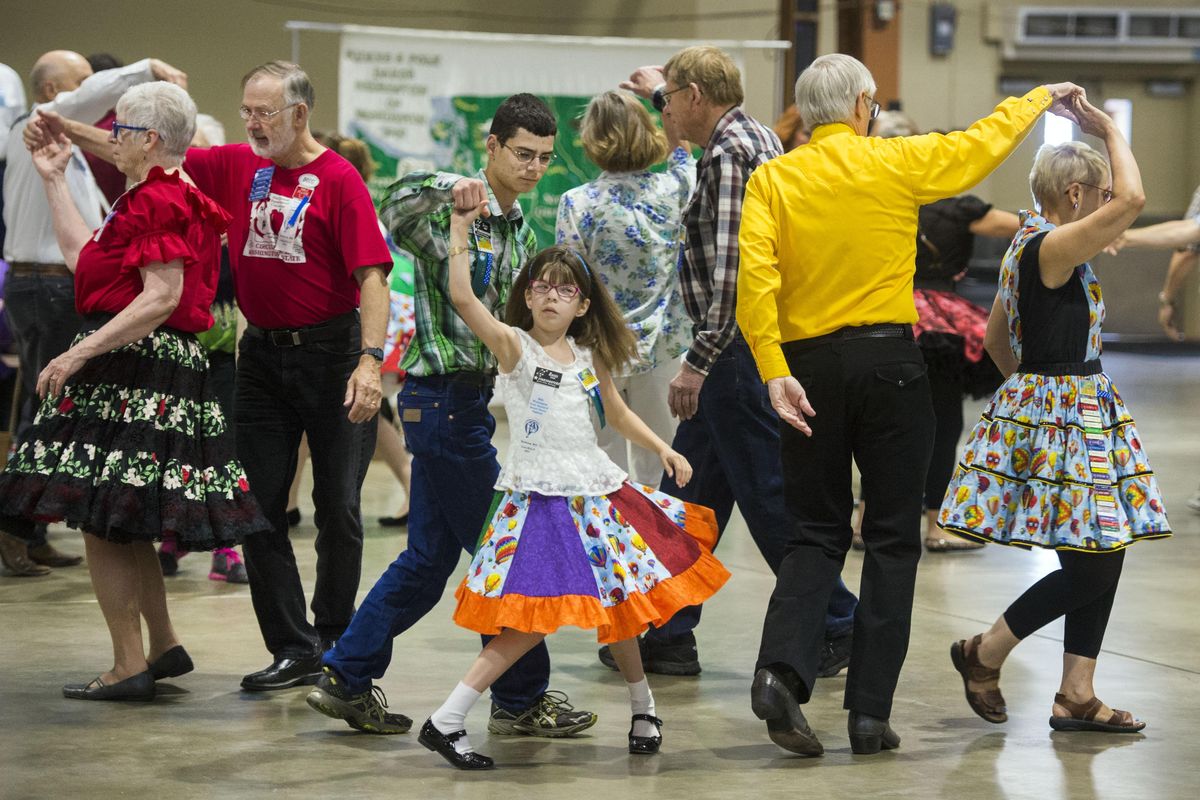 Dancers of all ages and abilities, including Daniel and Rachel Dion, center, of Spokane Valley, Wash, participate in at the 65th Annual Washington State Square Dance Festival, June 16, 2017, at the Spokane County Fair & Expo Center. (Dan Pelle / The Spokesman-Review)