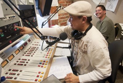 Gabe Bylilly,  front, and Jeff Ferguson work on their Native American radio show  “InnerTribal Beat” on Tuesday at the KYRS-FM studio in Spokane.  (Colin Mulvany / The Spokesman-Review)