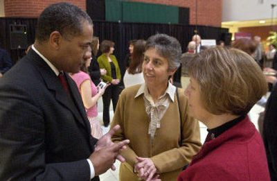 
Incoming Washington State University President Elson Floyd meets with WSU administrators Jessica Casselman, center, and Wendy Peterson on Friday at a reception in his name at the Lighty Student Services Building on the WSU Pullman campus. Floyd will be in Spokane at the Riverpoint campus on Monday.
 (Brian Immel / The Spokesman-Review)