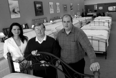 
Greg Skore, center, of Skore's Mattress, runs his business with his son, Joe Skore, and Angela Austin. 
 (Kathy Plonka / The Spokesman-Review)