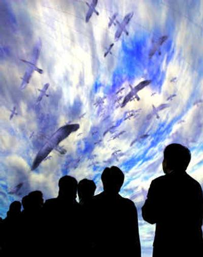 
Visitors watch Earth Vision, which is the worlds first 360-degree all-sky image system, at the Japan Pavilion during a press preview Friday of the Aichi Expo 2005 in Nagakute, central Japan.
 (Associated Press / The Spokesman-Review)