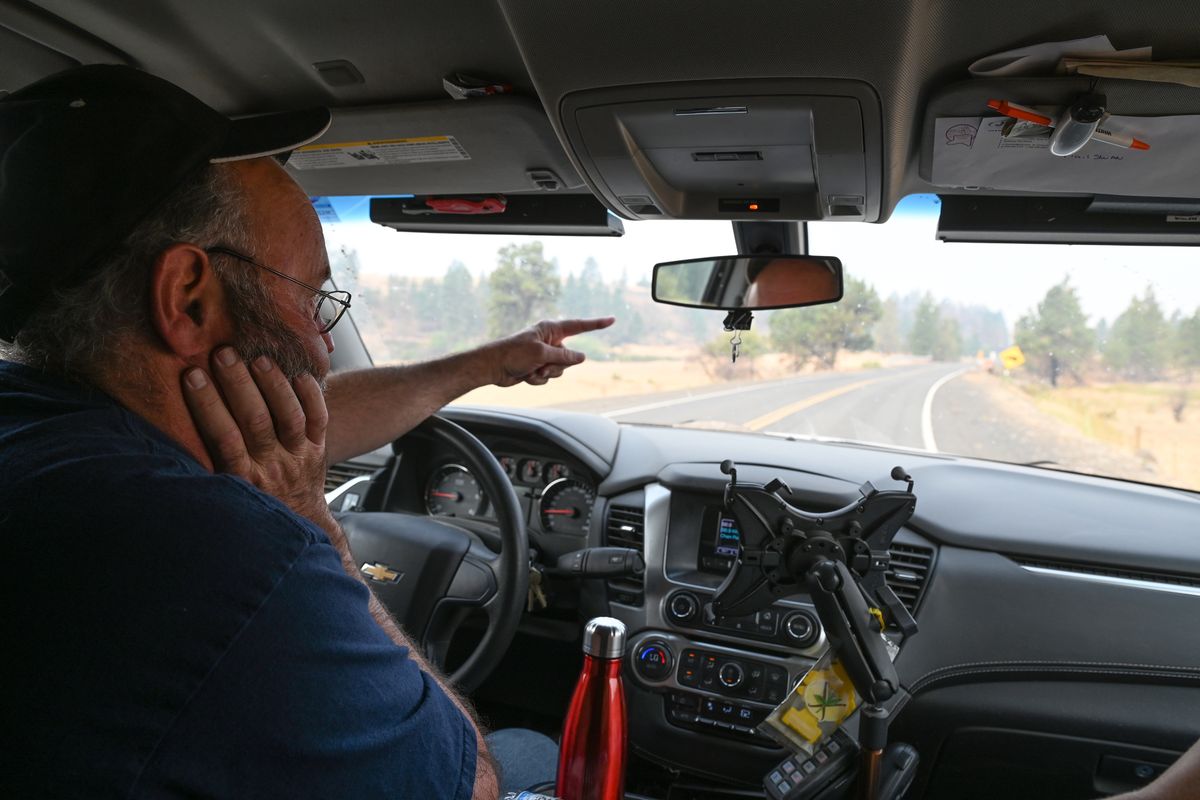 Rosalia fire Chief Bill Tensfeld, who is also the Whitman County Emergency Management director, points to one of the places near Malden, Washington, where the fire that started on Labor Day 2020 forced him to stop his truck on the way to Malden that fateful day.  (Jesse Tinsley/THE SPOKESMAN-REVI)