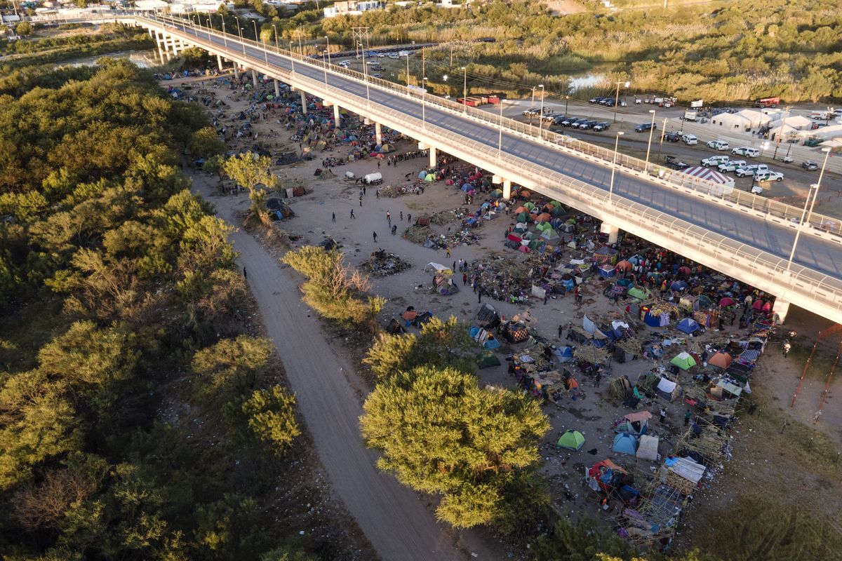 Migrants, many from Haiti, are seen in an encampment along the Del Rio International Bridge near the Rio Grande, Thursday, Sept. 23, 2021, in Del Rio, Texas.  (Julio Cortez)