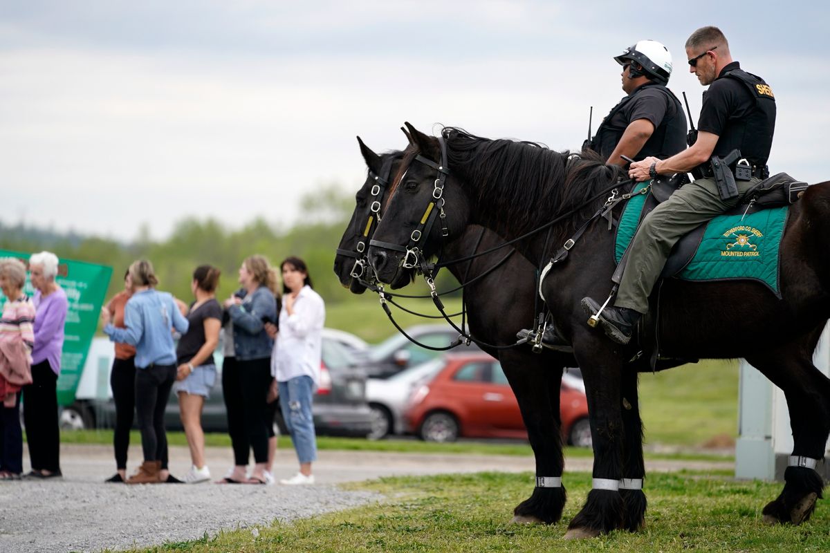 FILE -Officers on horseback guard the entrance to designated demonstrator areas near Riverbend Maximum Security Institution as people wait to enter before the scheduled execution of inmate Oscar Smith, Thursday, April 21, 2022, in Nashville, Tenn. Newly released records show at two least two people connected to a planned Tennessee execution that was abruptly put on hold April 21 knew the night before that the lethal injection drugs the state planned to use hadn’t undergone certain required testing. Last month, Gov. Bill Lee abruptly halted inmate Oscar Smith’s execution, citing an “oversight” in the execution process.  (Mark Humphrey)