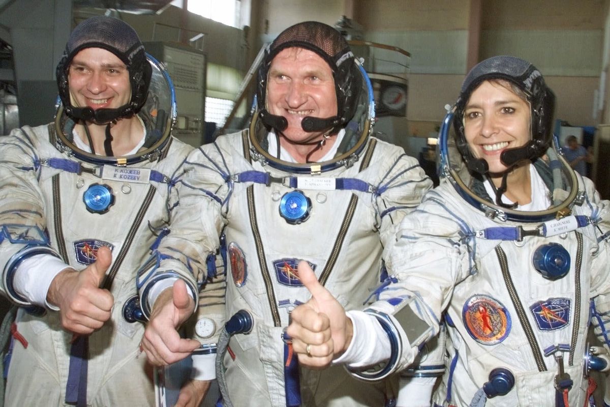 FILE - In this July 5, 2001 file photo, French astronaut Claudie Haignere, right, and her Russian crewmates Viktor Afanasyev, center, and Konstantin Kozeyev train inside the mock-up of a Soyuz TM spacecraft in Star City. The ESA, NASA