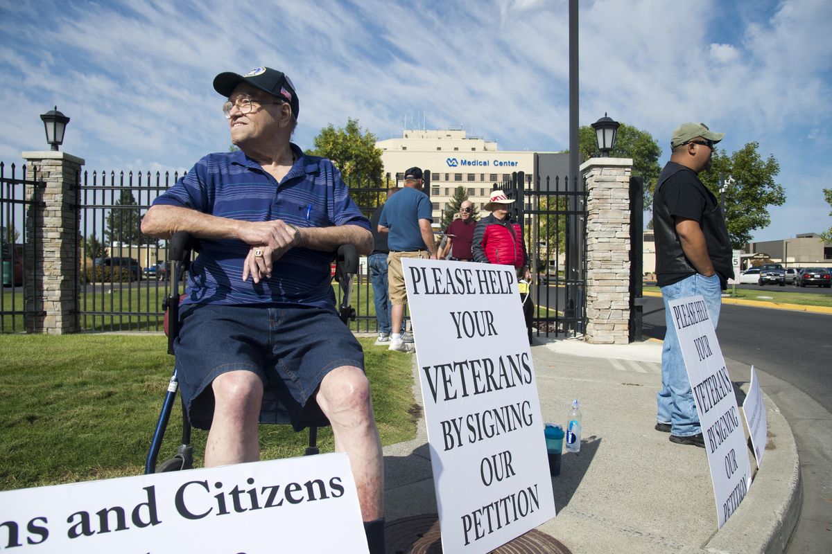 Air Force veteran Pat Fickle, 82, sits outside the Spokane Veterans Administration Medical Center Monday, Aug. 29, 2016 where veterans gathered to protest the closing of an exercise program that served patients  who needed fitness or therapy workouts. The veterans, ranging from World War II to the recent Gulf Wars, say the program and the camaraderie of the people involved have helped them lose weight and combat diabetes and back problems. Fickle said he reduced his insulin requirements and was weaned off oxygen by participating three times a week in the program. (Jesse Tinsley / The Spokesman-Review)