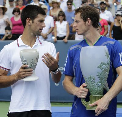 Novak Djokovic, left, and Andy Murray talk during the awards ceremony at the men's final at the Western & Southern Open. (Associated Press)